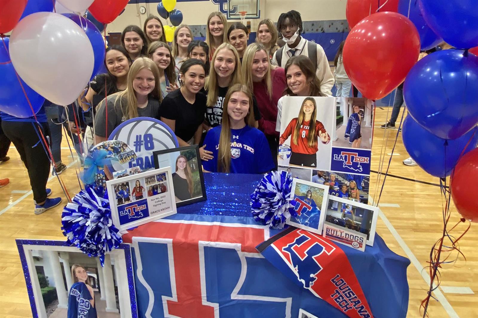 Cypress Creek senior Grace Krohn, seated, signed a letter of intent to play volleyball at Louisiana Tech University.